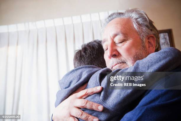 Grad Father Grandfather Comforting Child Photos and Premium High Res Pictures ...