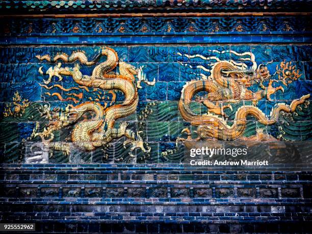 two dragons on 600 year old nine dragon screen in datong, china - shanxi province north east china stock pictures, royalty-free photos & images