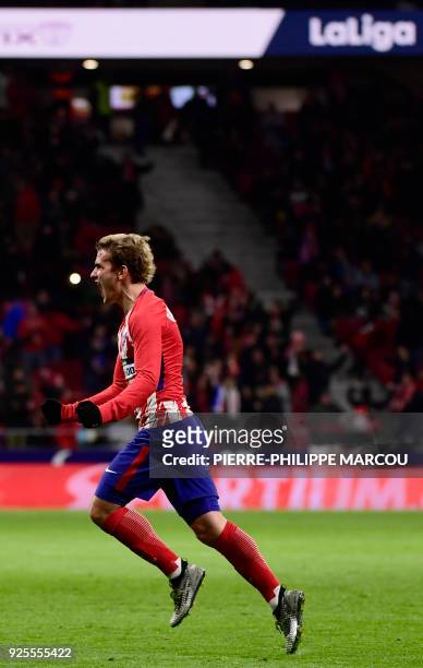 Atletico Madrid's French forward Antoine Griezmann celebrates his second goal during the Spanish league football match Club Atletico de Madrid...
