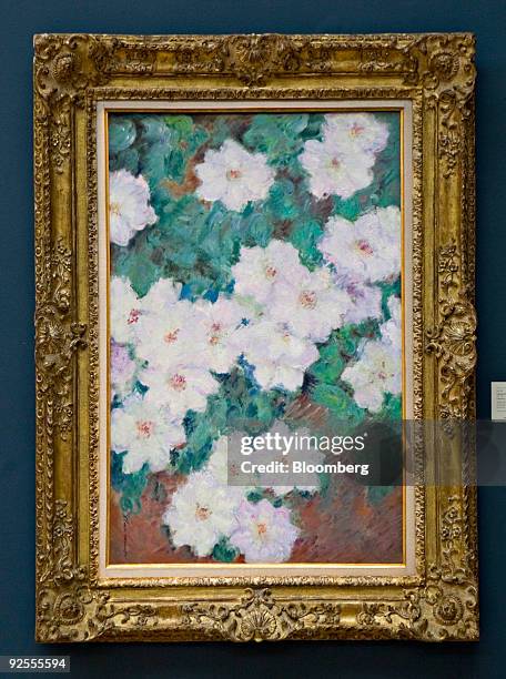 "Clematites" by Claude Monet hangs during a preview of the Impressionist and Modern Art fall sales at Sotheby's in New York, U.S., on Friday, Oct....