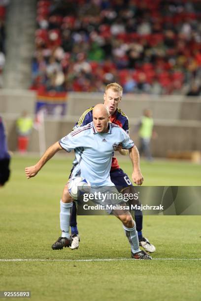 Nat Borchers of Real Salt Lake battles for the ball against Conor Casey of the Colorado Rapids at Rio Tinto Stadium on October 24, 2009 in Sandy,...