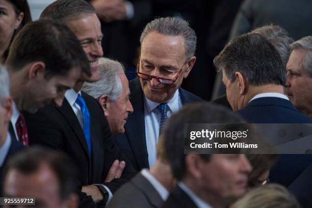 Senate Minority Leader Charles Schumer, D-N.Y., Sen. Bob Corker, R-Tenn., and other senators attend a ceremony in the Capitol Rotunda as the late...