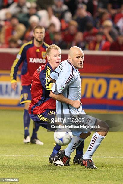 Nat Borchers of Real Salt Lake chases the ball down against Conor Casey of the Colorado Rapids at Rio Tinto Stadium on October 24, 2009 in Sandy,...