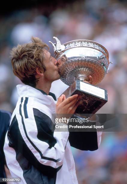 Juan Carlos Ferrero of Spain kissing the trophy after defeating Martin Verkerk of the Netherlands in the Men's Singles Final of the French Open...