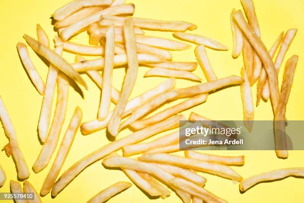 greasy french fries junk food fast food - batata frita francesa imagens e fotografias de stock