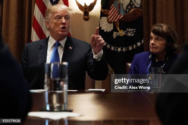 President Donald Trump speaks as Sen. Dianne Feinstein listens during a meeting with bipartisan members of the Congress at the Cabinet Room of the...