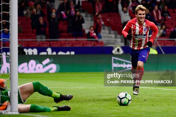 Atletico Madrid's French forward Antoine Griezmann celebrates his third goal during the Spanish league football match Club Atletico de Madrid against...