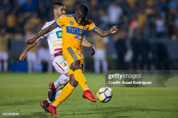 Enner Valencia of Tigres kicks the ball to score the first goal of his team during the second leg match between Tigres UANL and Herediano as part of...