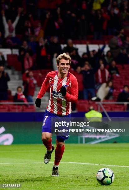 Atletico Madrid's French forward Antoine Griezmann celebrates his third goal during the Spanish league football match Club Atletico de Madrid against...