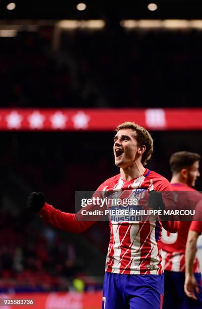 Atletico Madrid's French forward Antoine Griezmann celebrates his third goal during the Spanish league football match Club Atletico de Madrid against...