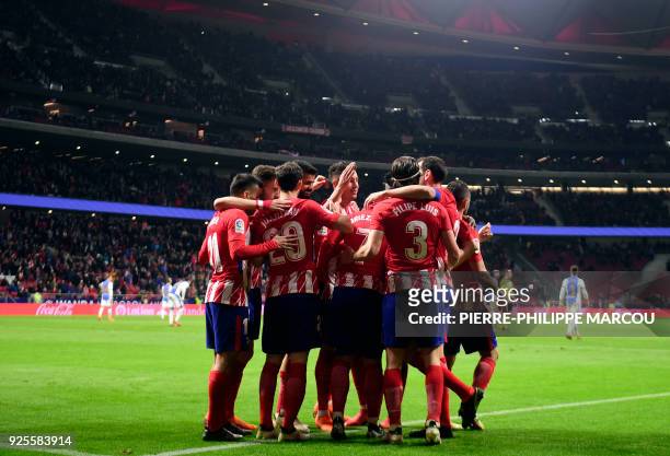 Atletico players celebrate their third goal during the Spanish league football match Club Atletico de Madrid against Club Deportivo Leganes SAD at...