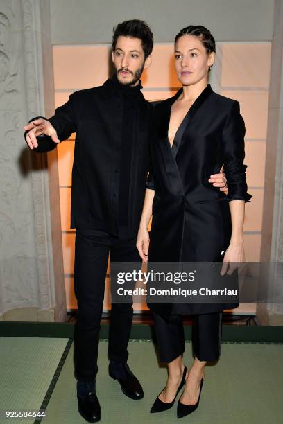 Pierre Niney and Natasha Andrews attend the H&M show as part of the Paris Fashion Week Womenswear Fall/Winter 2018/2019 on February 28, 2018 in...