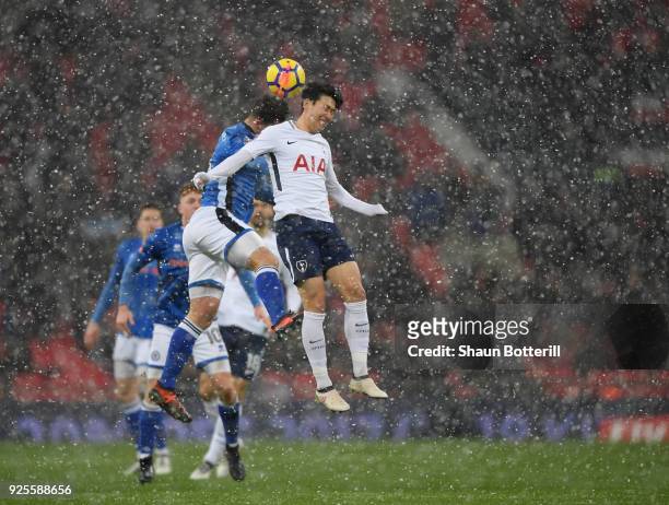 Heung-Min Son of Tottenham Hotspur rises for the ball under pressure from Harrison McGahey of Rochdale during the Emirates FA Cup Fifth Round Replay...