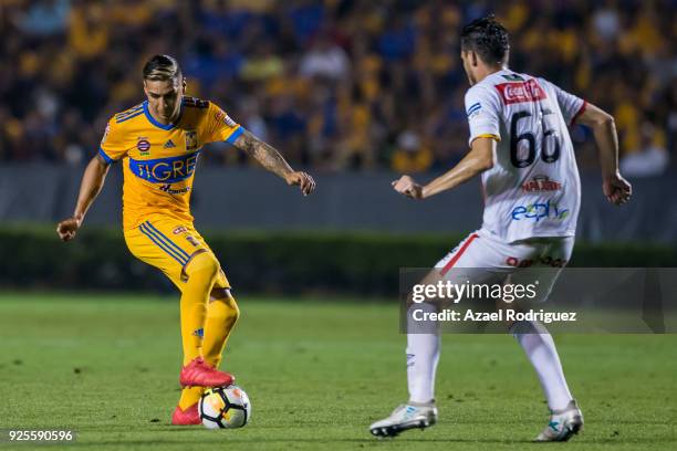 Ismael Sosa of Tigres fights for the ball with Juan Pablo Vargas of Herediano during the second leg match between Tigres UANL and Herediano as part...