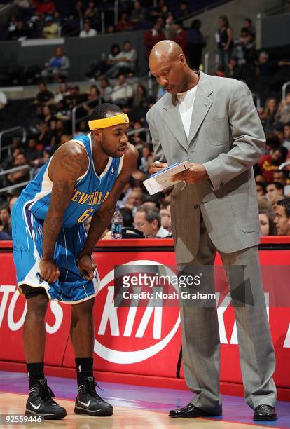Head coach Byron Scott talks to Bobby Brown of the New Orleans Hornets during the preseason game against the Los Angeles Clippers on October 23, 2009...