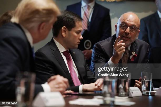 Rep. Ted Deutch speaks as Sen. Marco Rubio and President Donald Trump listen during a meeting with bipartisan members of the Congress at the Cabinet...