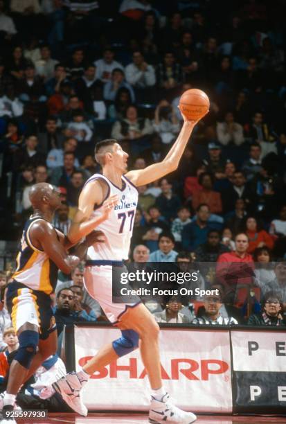 Gheorghe Muresan of the Washington Bullets in action against the Indiana Pacers during an NBA basketball game circa 1995 at the US Airways Arena in...