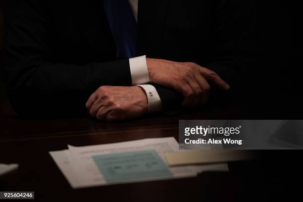 President Donald Trump listens during a meeting with bipartisan members of the Congress at the Cabinet Room of the White House February 28, 2018 in...