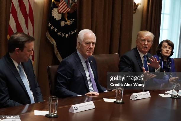 President Donald Trump speaks as Sen. Christopher Murphy , Senate Majority Whip Sen. John Cornyn and Sen. Dianne Feinstein listen during a meeting...