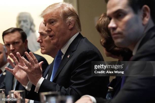President Donald Trump speaks as Sen. Christopher Murphy , Senate Majority Whip Sen. John Cornyn and Sen. Marco Rubio listen during a meeting with...