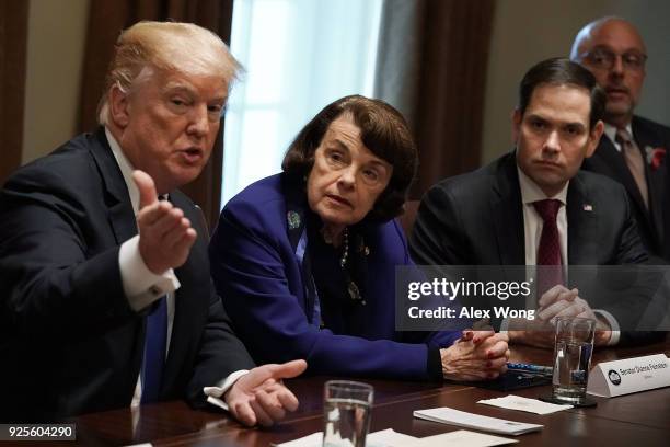 President Donald Trump speaks as Sen. Dianne Feinstein , Sen. Marco Rubio and Rep. Ted Deutch listen during a meeting with bipartisan members of the...