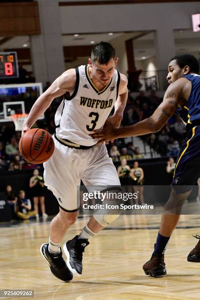 Fletcher Magee guard Wofford College Terriers works with the basketball against the University of North Carolina Greensboro Spartans, Tuesday,...