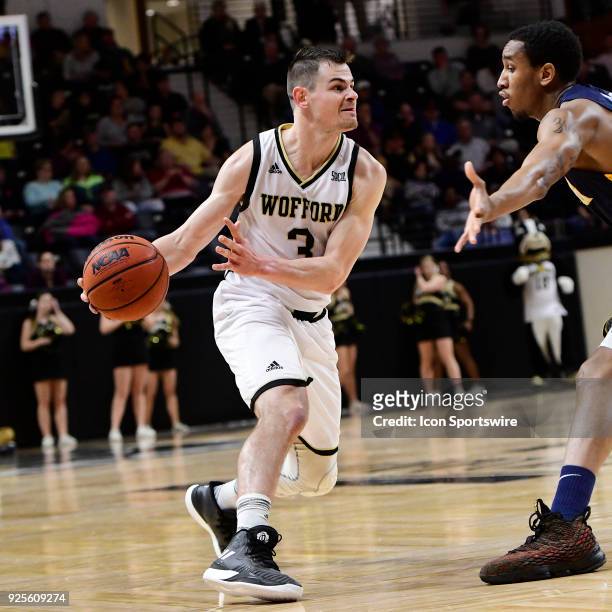 Fletcher Magee guard Wofford College Terriers works with the basketball against the University of North Carolina Greensboro Spartans, Tuesday,...