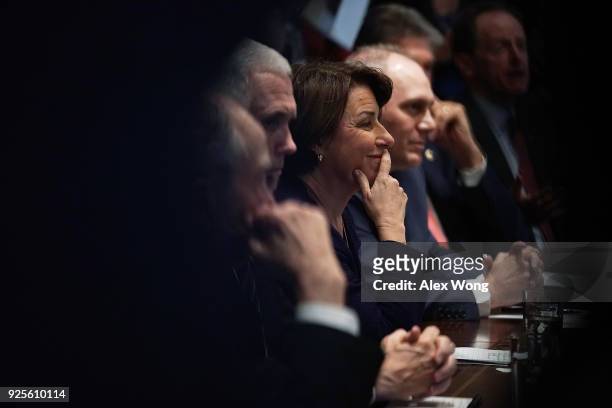 Vice President Mike Pence, Sen. Amy Klobuchar and House Majority Whip Rep. Steve Scalise listen during a meeting with President Donald Trump at the...