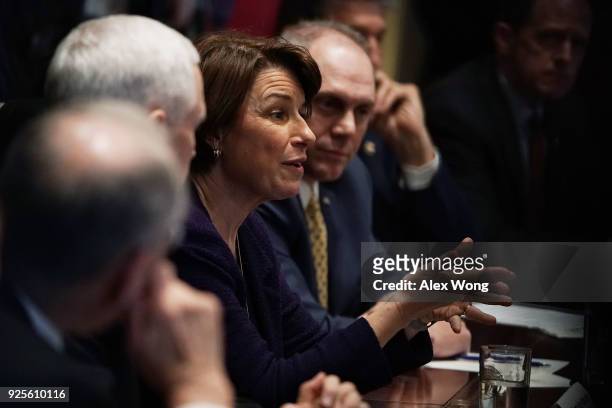 Sen. Amy Klobuchar speaks as House Majority Whip Rep. Steve Scalise listens during a meeting with President Donald Trump at the Cabinet Room of the...