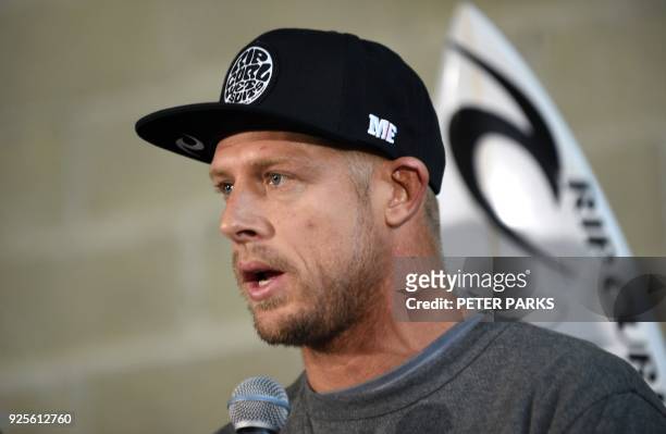File photo taken on July 21, 2015 shows Australian surf champion Mick Fanning takes questions at a press conference in Sydney. Australia's three-time...