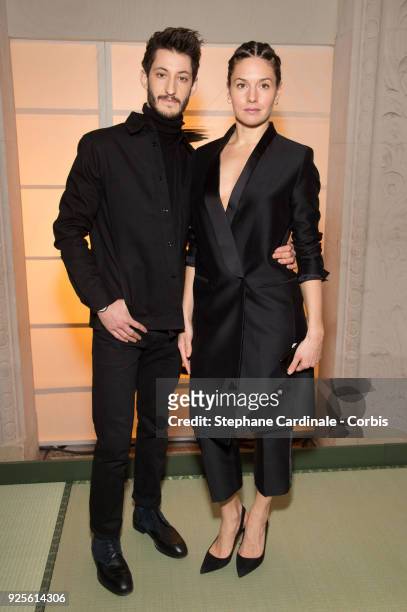 Pierre Niney and Natasha Andrews attends the H&M show as part of the Paris Fashion Week Womenswear Fall/Winter 2018/2019 on February 28, 2018 in...