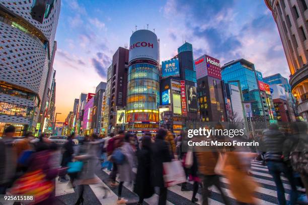 luxury shopping streets with neon signs, ginza avenues lined with shops of expensive brands in the heart of tokyo, japan - asien metropole nachtleben stock-fotos und bilder