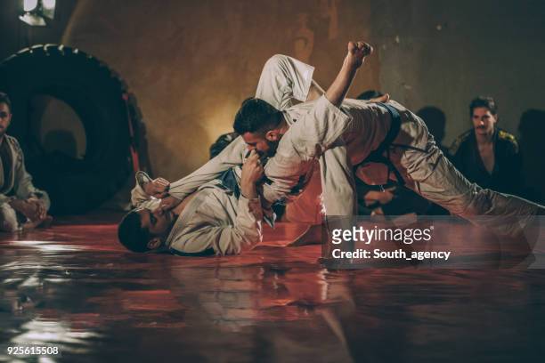 jujitsu skills on practice - martial arts stock pictures, royalty-free photos & images