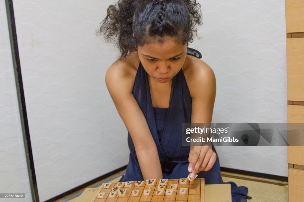 Girl playing Shogi