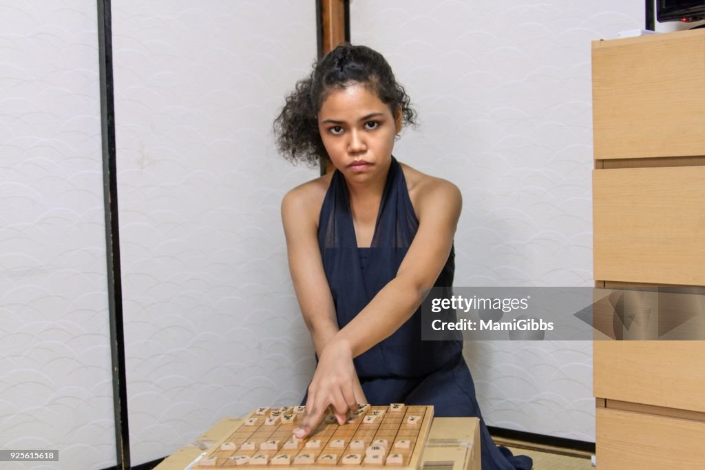 Girl playing Shogi