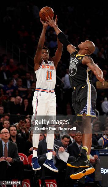 Frank Ntilikina of the New York Knicks shoots a three point shot in an NBA basketball game against the Golden State Warriors on February 26, 2018 at...
