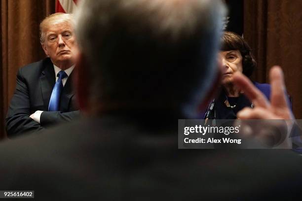 President Donald Trump and Sen. Dianne Feinstein listen during a meeting with bipartisan members of the Congress at the Cabinet Room of the White...