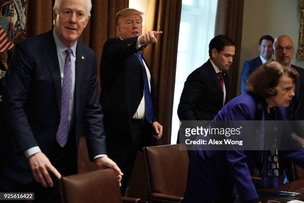 President Donald Trump gestures after a meeting with bipartisan members of the Congress, including Senate Majority Whip Sen. John Cornyn , Sen. Marco...