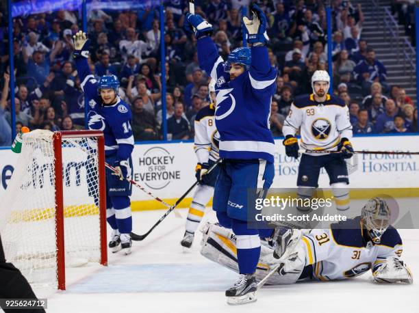 Cory Conacher of the Tampa Bay Lightning celebrates his goal against goalie Chad Johnson of the Buffalo Sabres during the first period at Amalie...