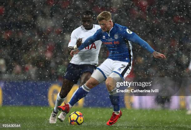 Moussa Sissoko of Tottenham Hotspur and Stephen Humphreys of Rochdale during The Emirates FA Cup Fifth Round Replay between Tottenham Hotspur and...