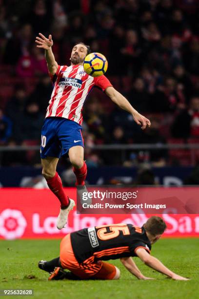 Juan Francisco Torres Belen, Juanfran, of Atletico de Madrid fights for the ball with Antonio Latorre Grueso, Lato, of Valencia CF during the La Liga...