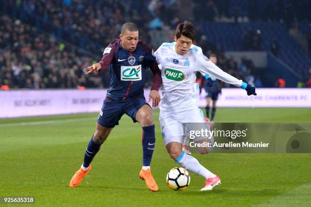 Kylian Mbappe of Paris Saint-Germain and Hiroki Sakai of Olympique de Marseille fight for the ball during the French Cup match between Paris...