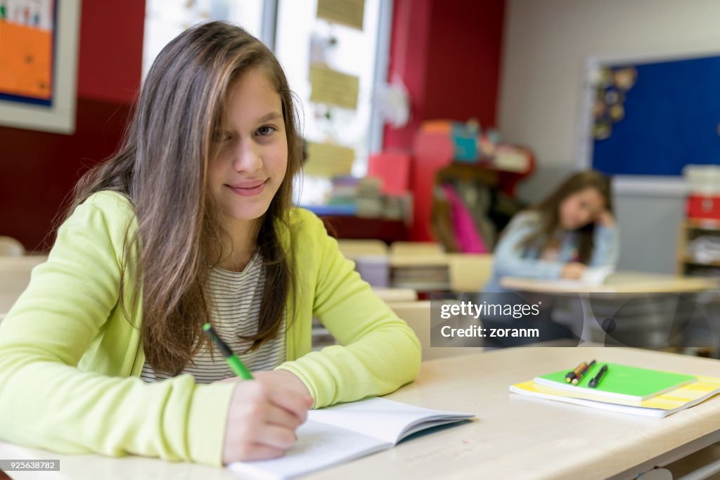Girl Writing Assignment Schoolgirl Writing In Notebook High-Res Stock Photo - Getty Images