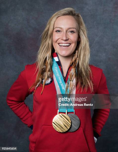 Snowboarder Jamie Anderson of the United States poses for a portrait with her gold medal for Ladies' Slopestyle and silver medal for Ladies' Big Air...