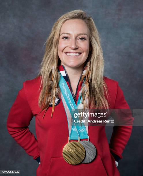 Snowboarder Jamie Anderson of the United States poses for a portrait with her gold medal for Ladies' Slopestyle and silver medal for Ladies' Big Air...