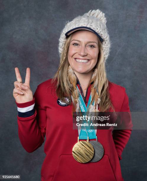 Snowboarder Jamie Anderson of the United States poses for a portrait with her gold medal for Ladies' Slopestyle and silver medal for Ladies' Big Air...