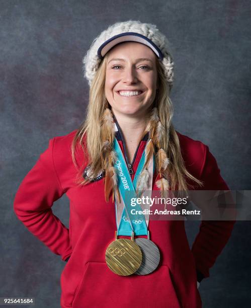 Snowboarder Jamie Anderson of the United States poses for a portrait with her gold medal for Ladies' Slopestyle and silver medal for Ladies' Big Air...