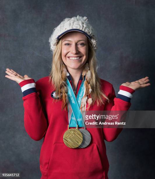 Snowboarder Jamie Anderson of the United States poses for a portrait with her gold medal for Ladies' Slopestyle and silver medal for Ladies' Big Air...