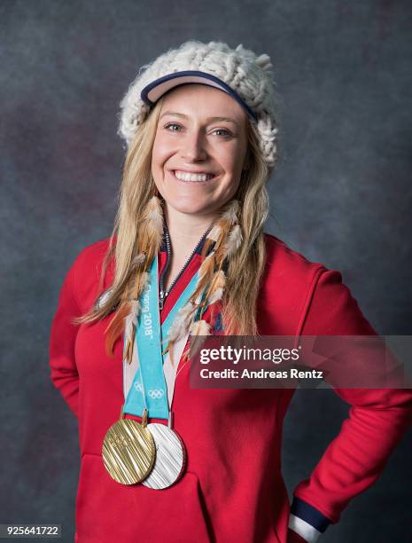 Snowboarder Jamie Anderson of the United States poses for a portrait with her gold medal for Ladies' Slopestyle and silver medal for Ladies' Big Air...