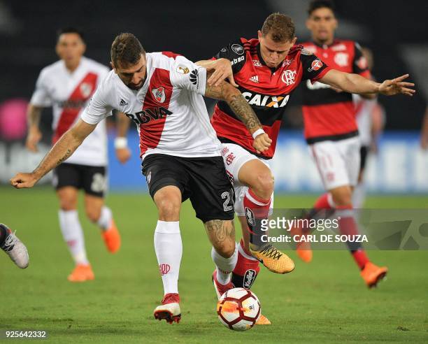 Brazil's Flamengo player Juan vies for the ball with Argentina's River Plate Lucas Pratto, during their group stage Libertadores football match at...